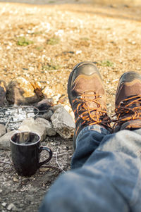 Low section of man wearing shoes