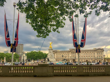 Ferris wheel in city against sky