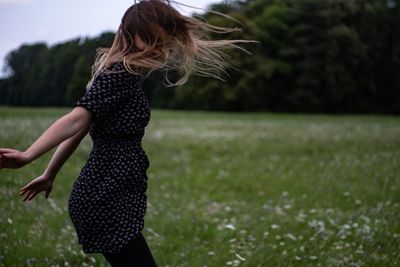 Woman jumping on field