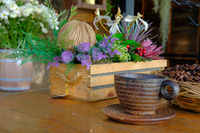 Close-up of flowering plants in basket on table