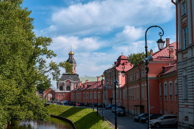 Street amidst buildings against sky in city