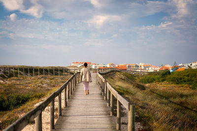 Pier over sea against sky