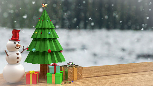 Christmas decorations on snow covered table