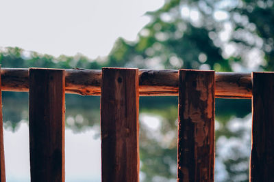 Close-up of wooden fence against sky