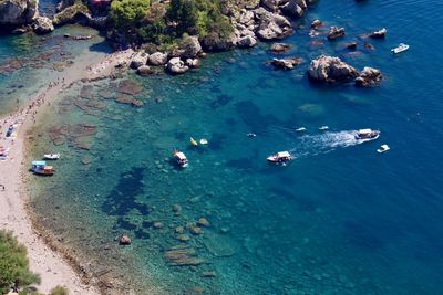 High angle view of boats on sea shore