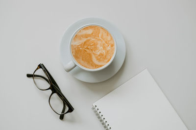 High angle view of coffee cup on table