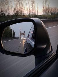 Reflection of car on side-view mirror