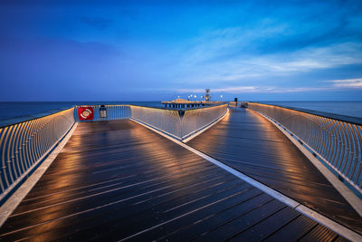 Pier over sea against sky