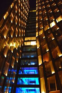 Low angle view of modern building at night