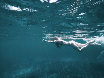 Woman swimming in sea