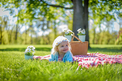 Portrait of girl sitting on grass