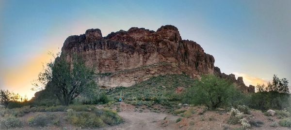 Low angle view of rock formations against sky