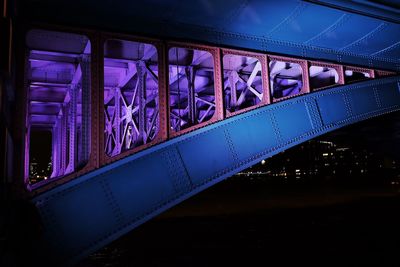 Illuminated bridge at night