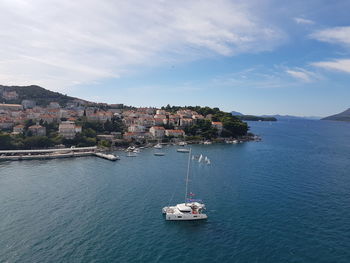 High angle view of sailboat sailing on sea against sky