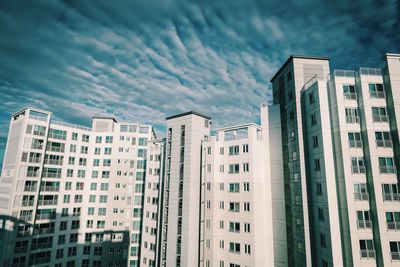 Modern buildings in city against sky