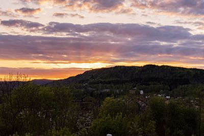 Scenic view of landscape against sky during sunset