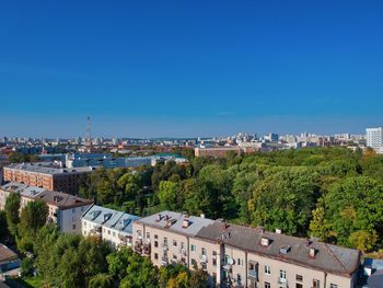 High angle view of townscape against blue sky