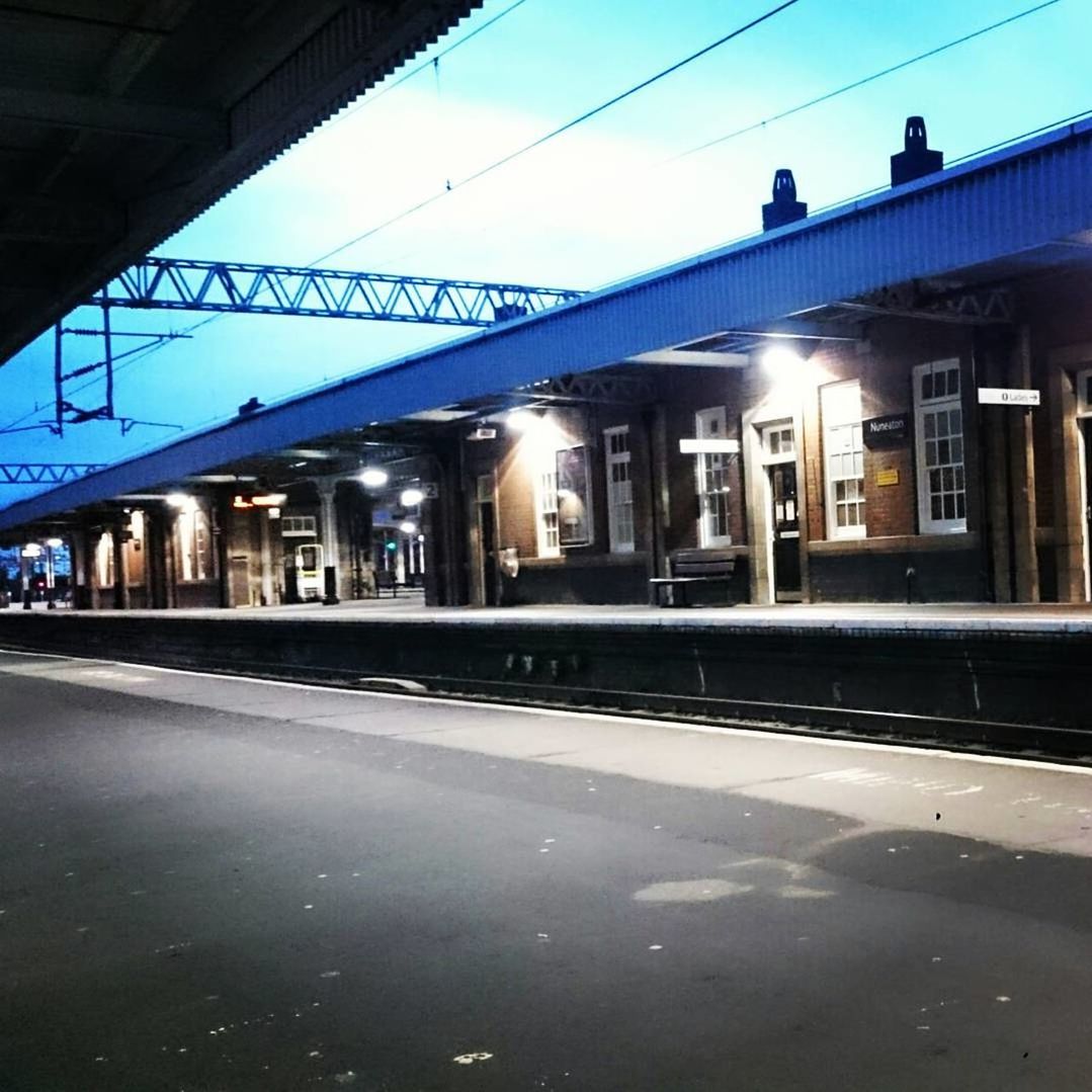 ILLUMINATED RAILROAD STATION PLATFORM