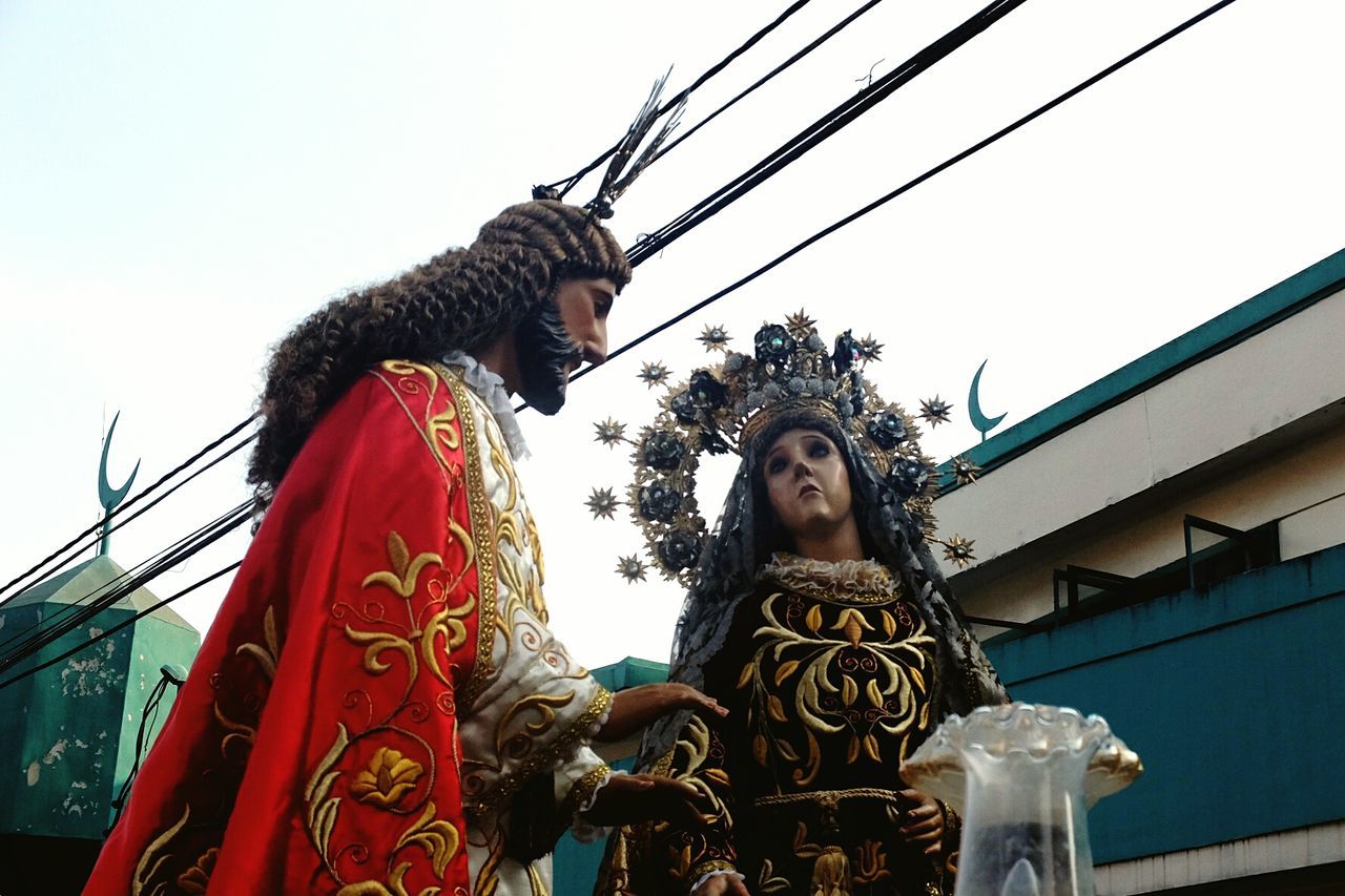 LOW ANGLE VIEW OF STATUES AGAINST SKY