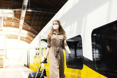 Woman standing in a train