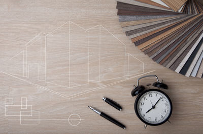 High angle view of clock on table
