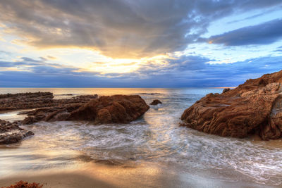 Scenic view of sea against sky at sunset