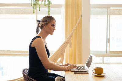 Woman working at home with laptop. home office.  notebook for working. 