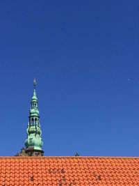 High section of kronborg castle roof against clear blue sky