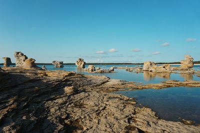 Scenic view of sea against blue sky