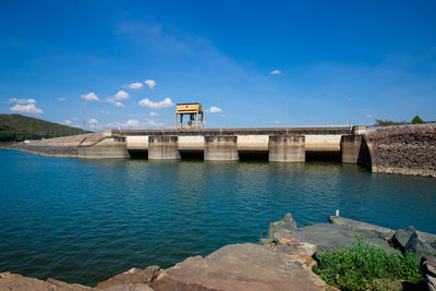 View of dam and bridge against sky