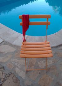 High angle view of chair in swimming pool