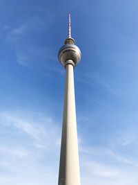 Low angle view of communications tower against sky