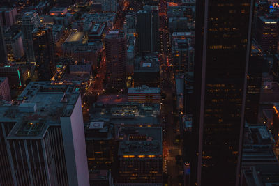 Aerial view of city lit up at night