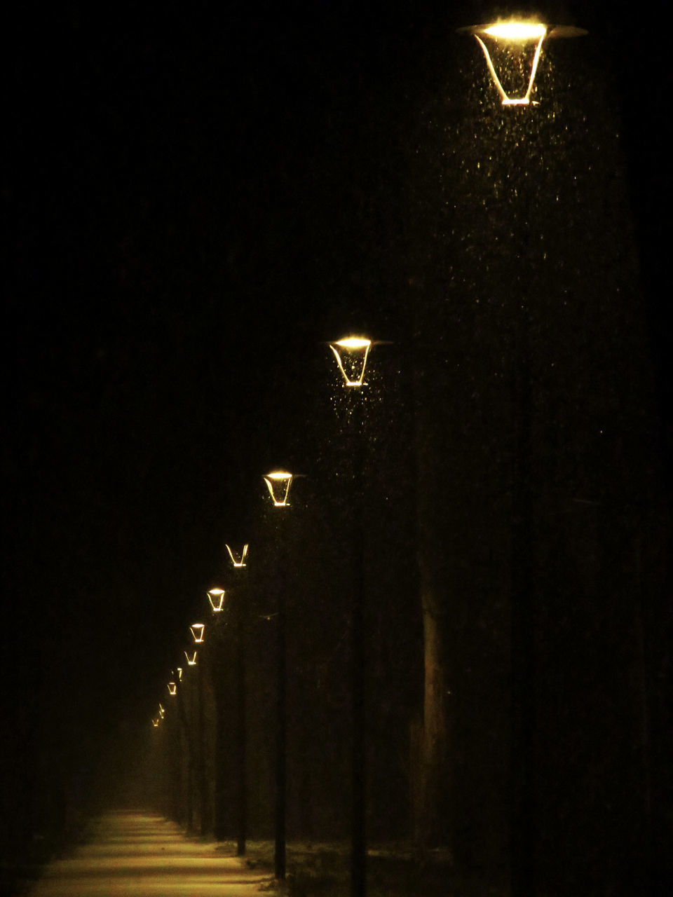 LOW ANGLE VIEW OF ILLUMINATED STREET LIGHT