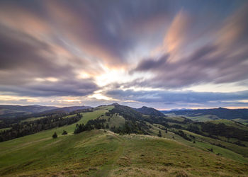 Scenic view of mountains against sky during sunset