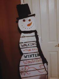 Close-up of text on wall at home