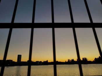 Close-up of cityscape against sky during sunset