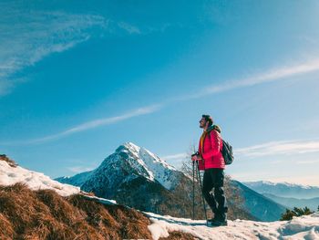 Man standing on mountain against sky