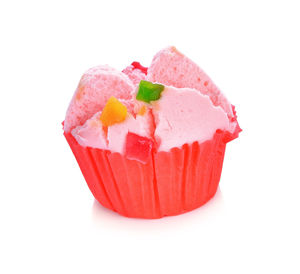 Close-up of strawberry cake against white background