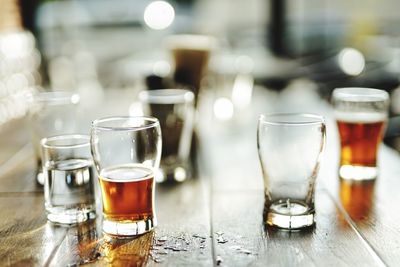 Close-up of beer glass on table