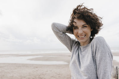 Portrait of happy woman on the beach