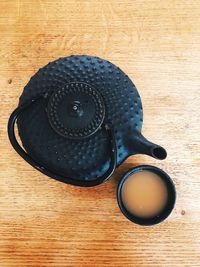 High angle view of black coffee on table