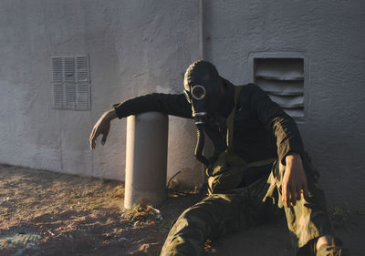 Man in front of built structure