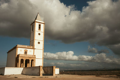 Low angle view of church and building against sky