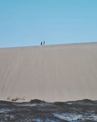 Scenic view of desert against clear sky