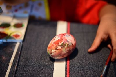 Close-up of hand holding ice cream