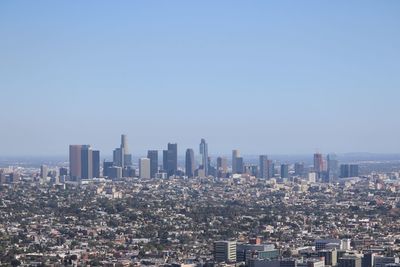 Aerial view of modern buildings against clear sky