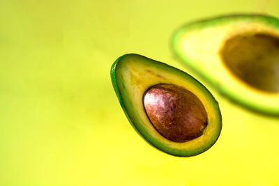 Close-up of fruit against green background