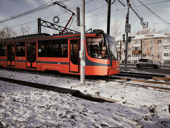 Train on railroad track in city