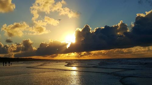 Scenic view of calm sea at sunset